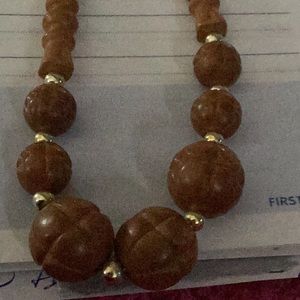 Necklace large and and sm. Beads .with gold chain is twisted